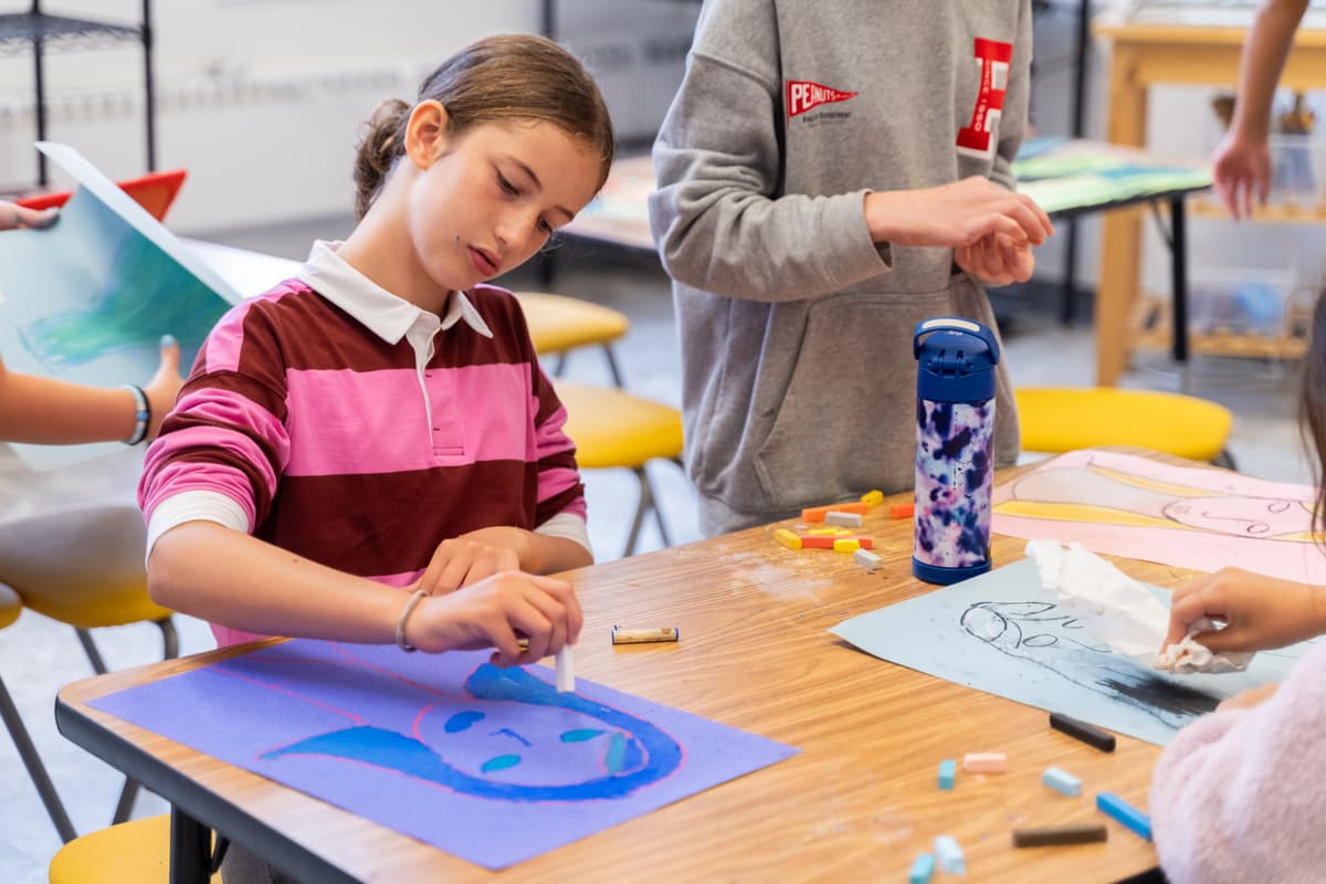 Students in Shared Space with art project